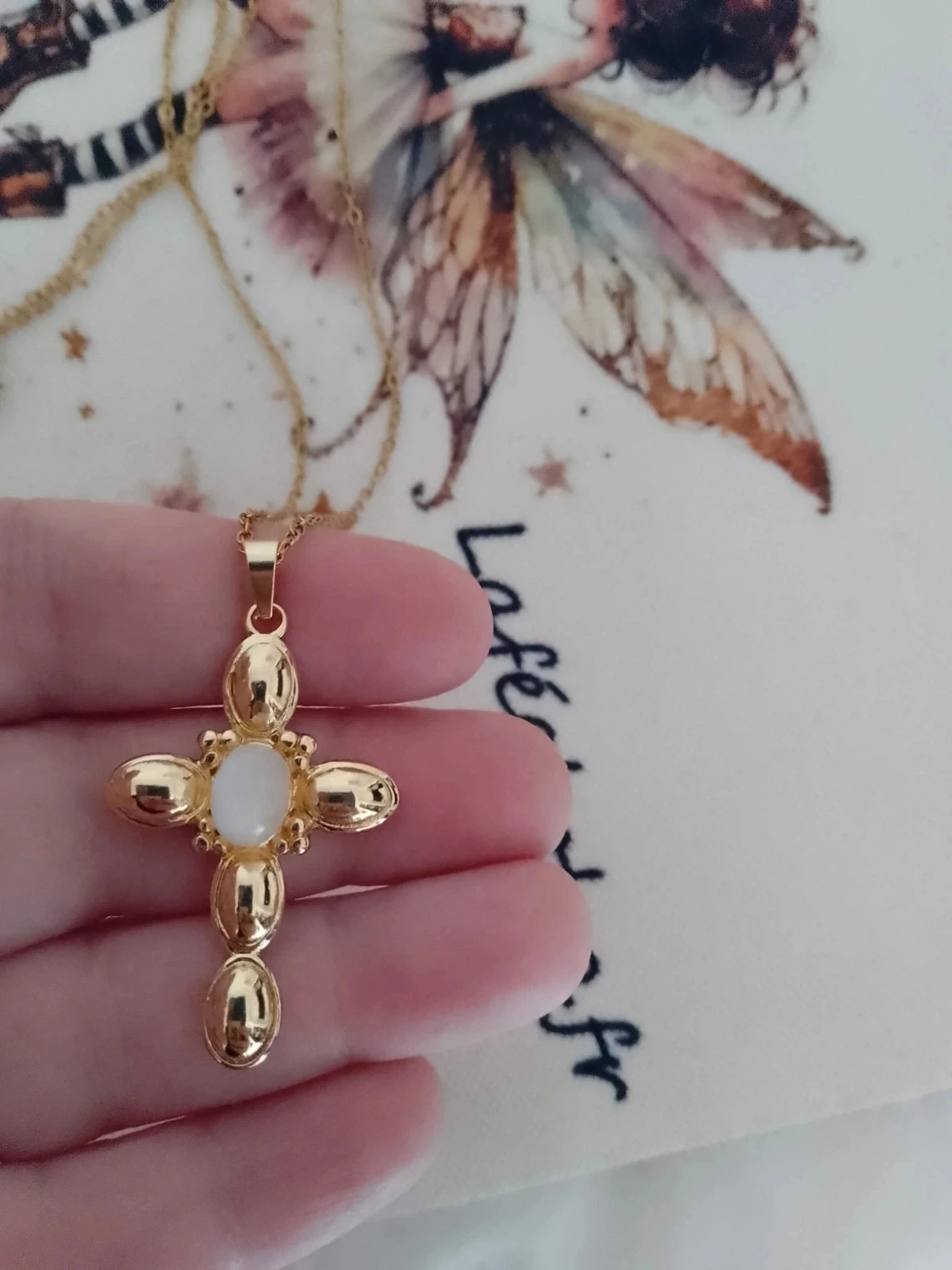 Golden cross necklace with moonstone – photo 2